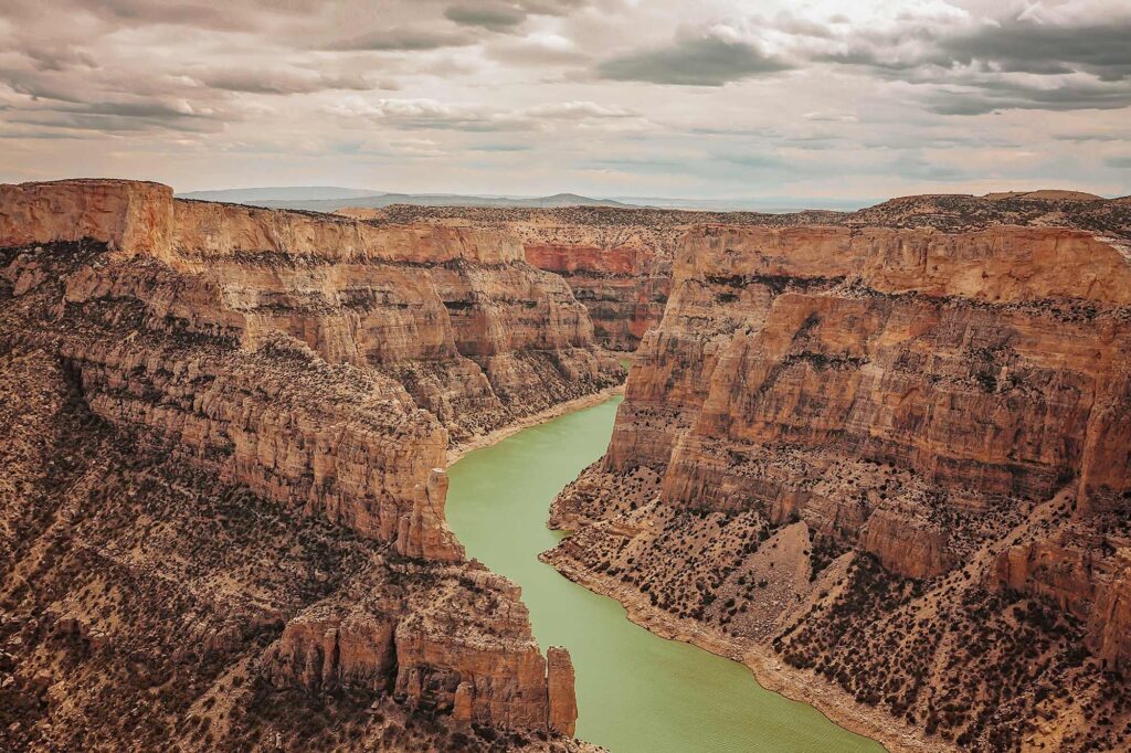 Scenic canyon road overlooking a winding river near Escalante Utah