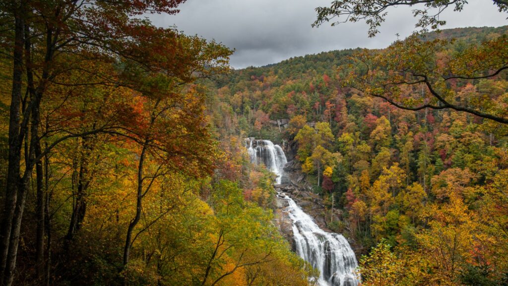 Whitewater Falls in North Carolina surrounded by colorful fall foliage