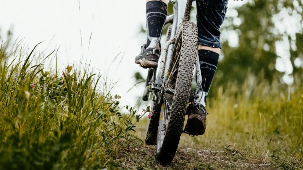 Mountain biker riding through grassy trail near Chattanooga, Tennessee