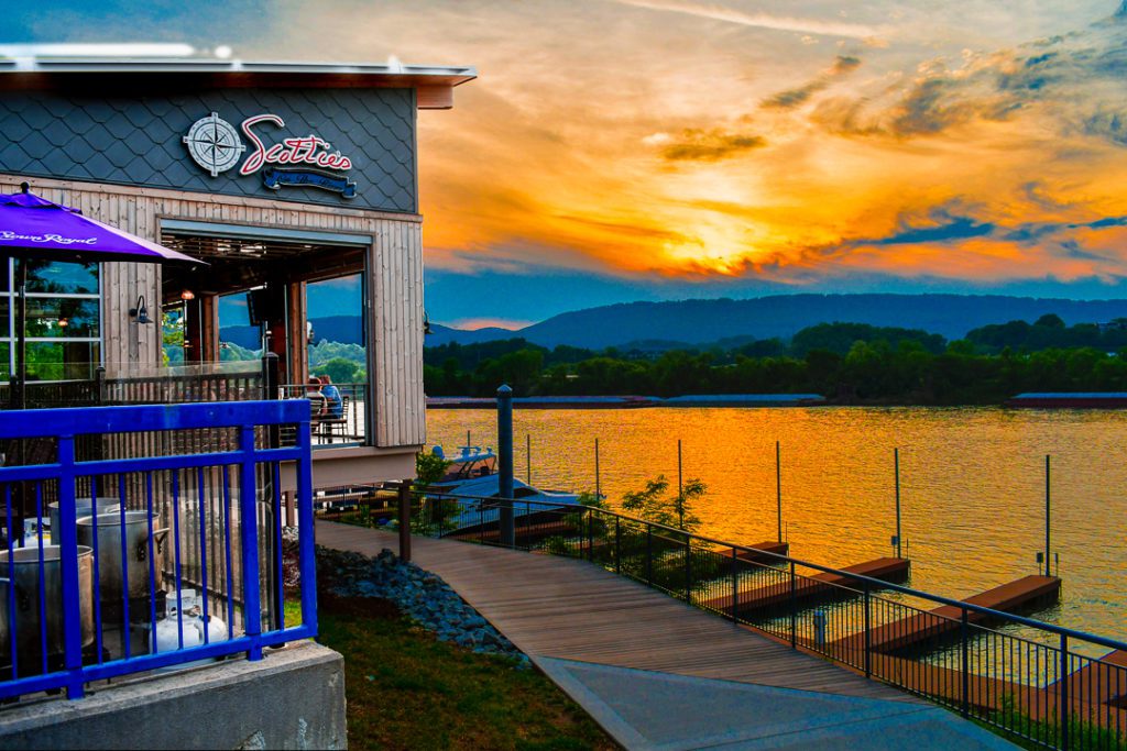 Exterior of Scottie's on the River at sunset